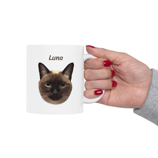 Hand holding a white custom mug featuring Siamese cat portrait with name Luna, great for pet lovers and anniversaries.